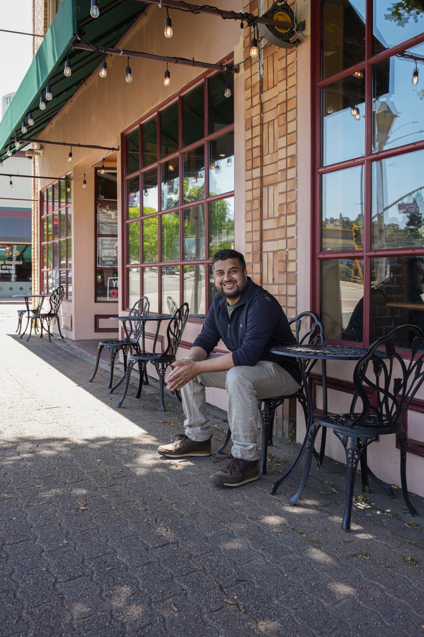 Muzamil Khan at a café table in Old Town Pinole